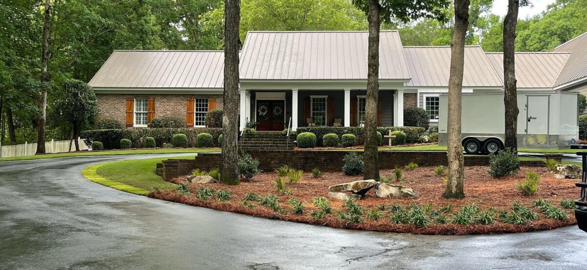 flowerbed in the middle of an island in the middle of a driveway