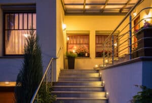 Elegant lighted outside stairs with metal handrail